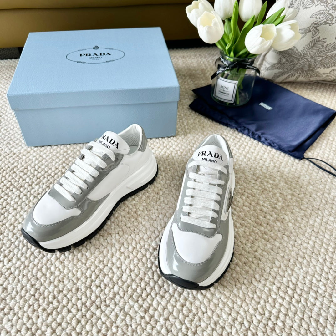 PRADA BLACK THICK SOLE SNEAKER GRAY AND WHITE CALFSKIN