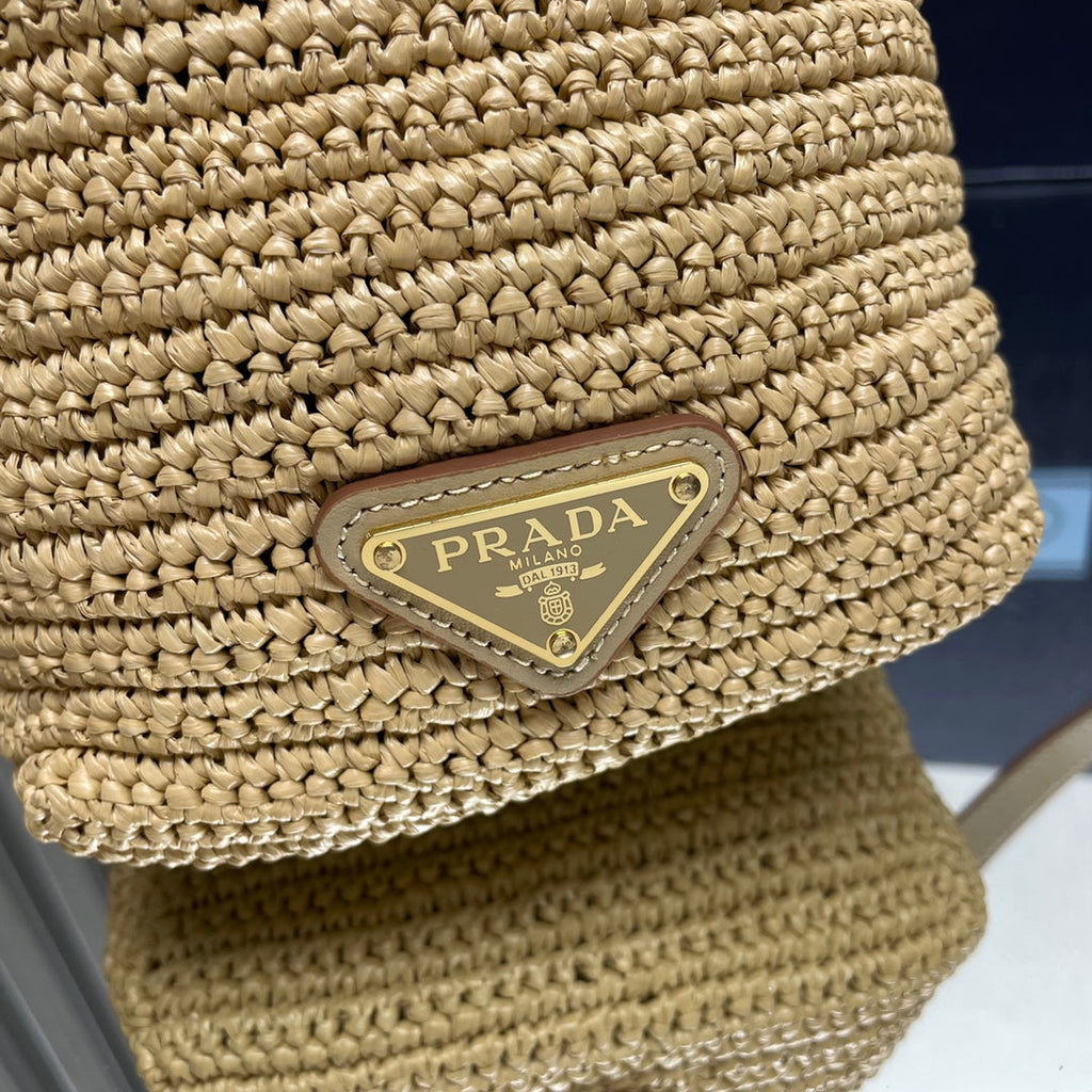 PRADA BUCKET BAG 20 IN BEIGE WOVEN RAFFIA EMBOSSED LOGO