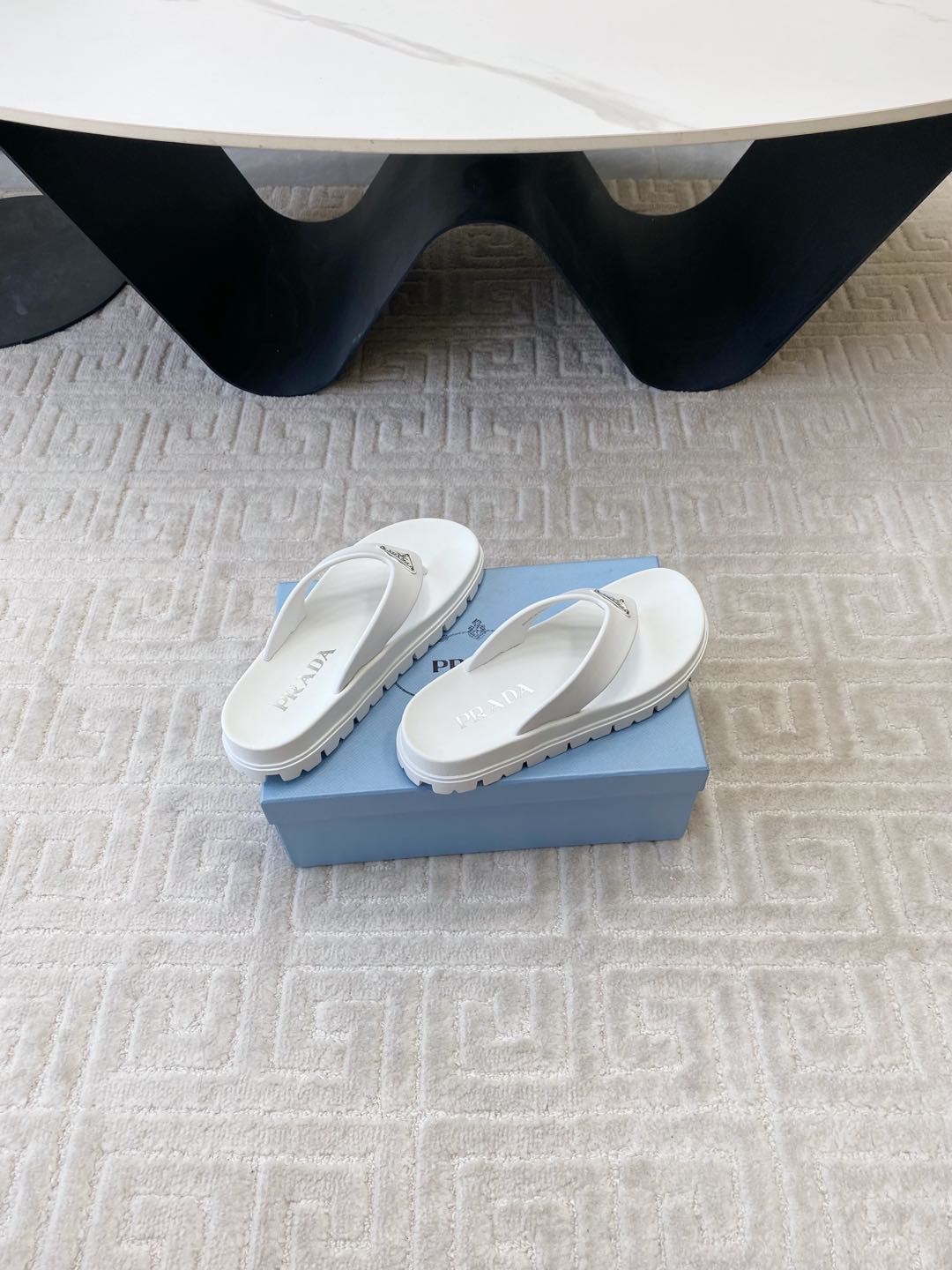 PRADA THICK-SOLED FLIP FLOPS IN WHITE RUBBER