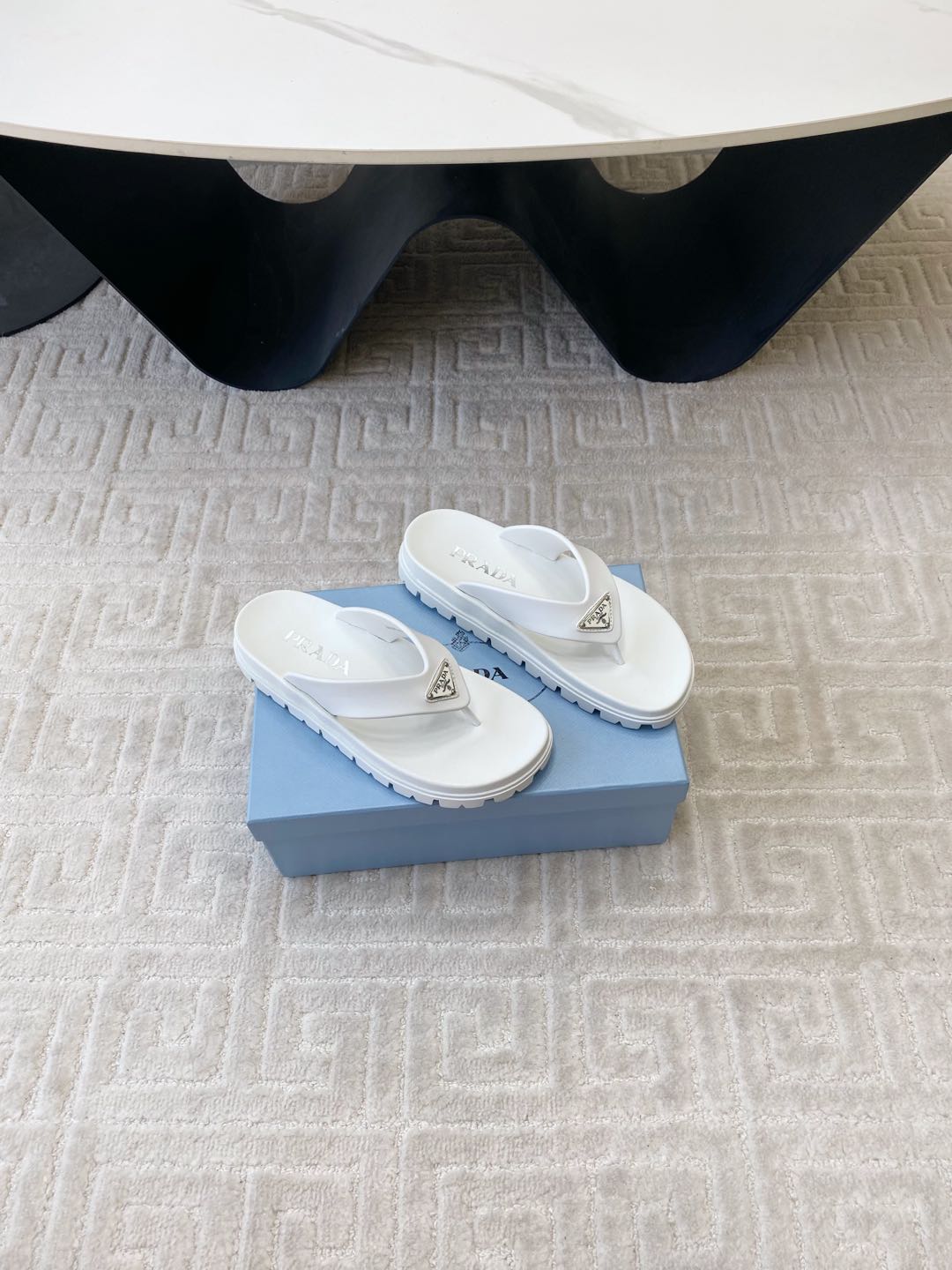 PRADA THICK-SOLED FLIP FLOPS IN WHITE RUBBER