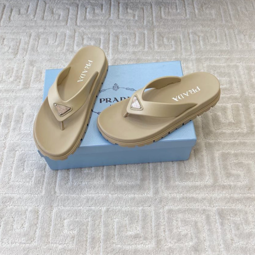PRADA THICK-SOLED FLIP FLOPS IN ECRU BEIGE RUBBER