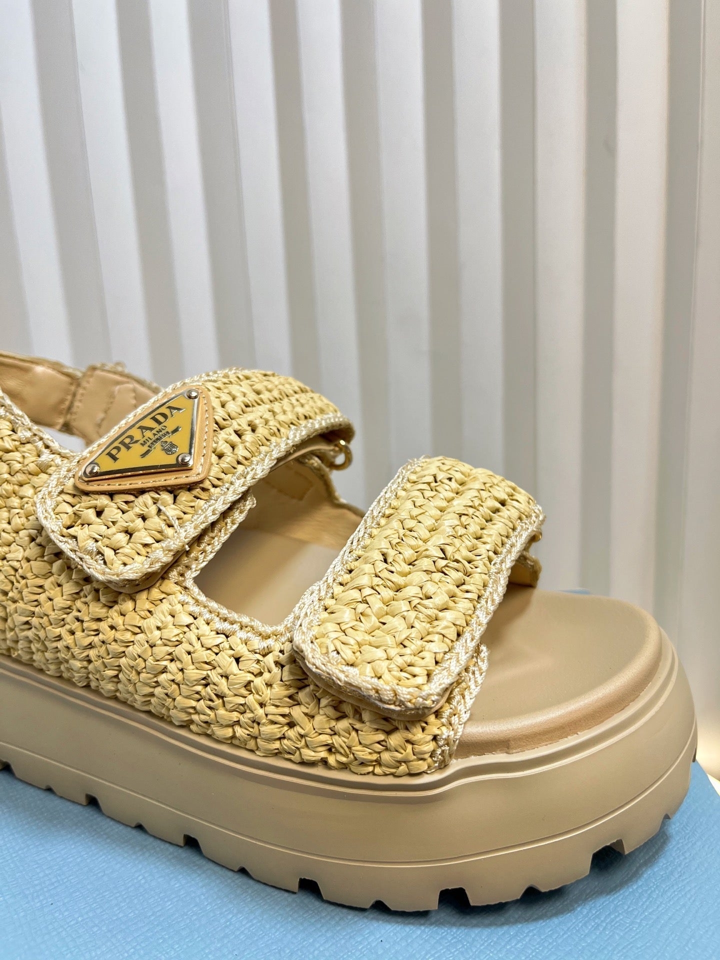 PRADA THICK-SOLED SLIDE IN BEIGE RAFFIA