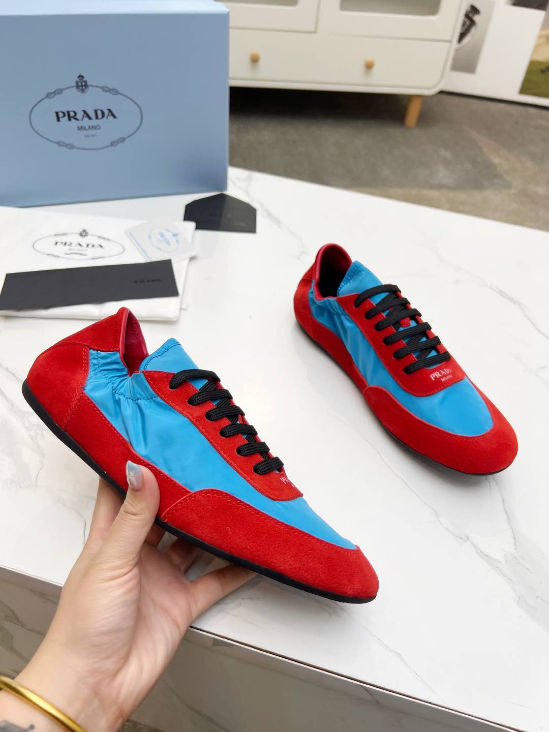 PRADA COLLAPSE SNEAKERS IN RED SUEDE AND SKY BLUE NYLON