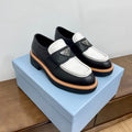 PRADA CHOCOLATE LOAFERS BLACK AND WHITE CALFSKIN