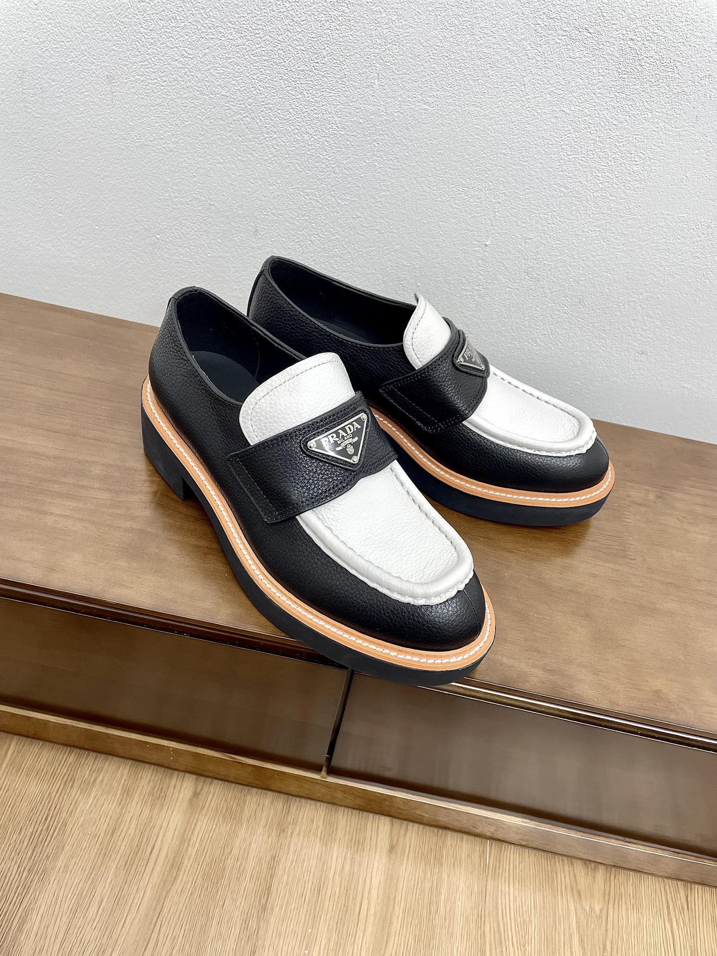 PRADA CHOCOLATE LOAFERS BLACK AND WHITE CALFSKIN