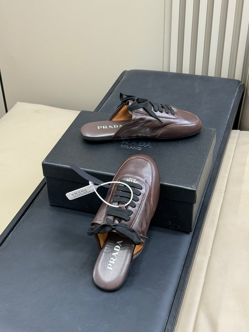 PRADA 25S COLLAPSE MULES IN RK BROWN CALFSKIN