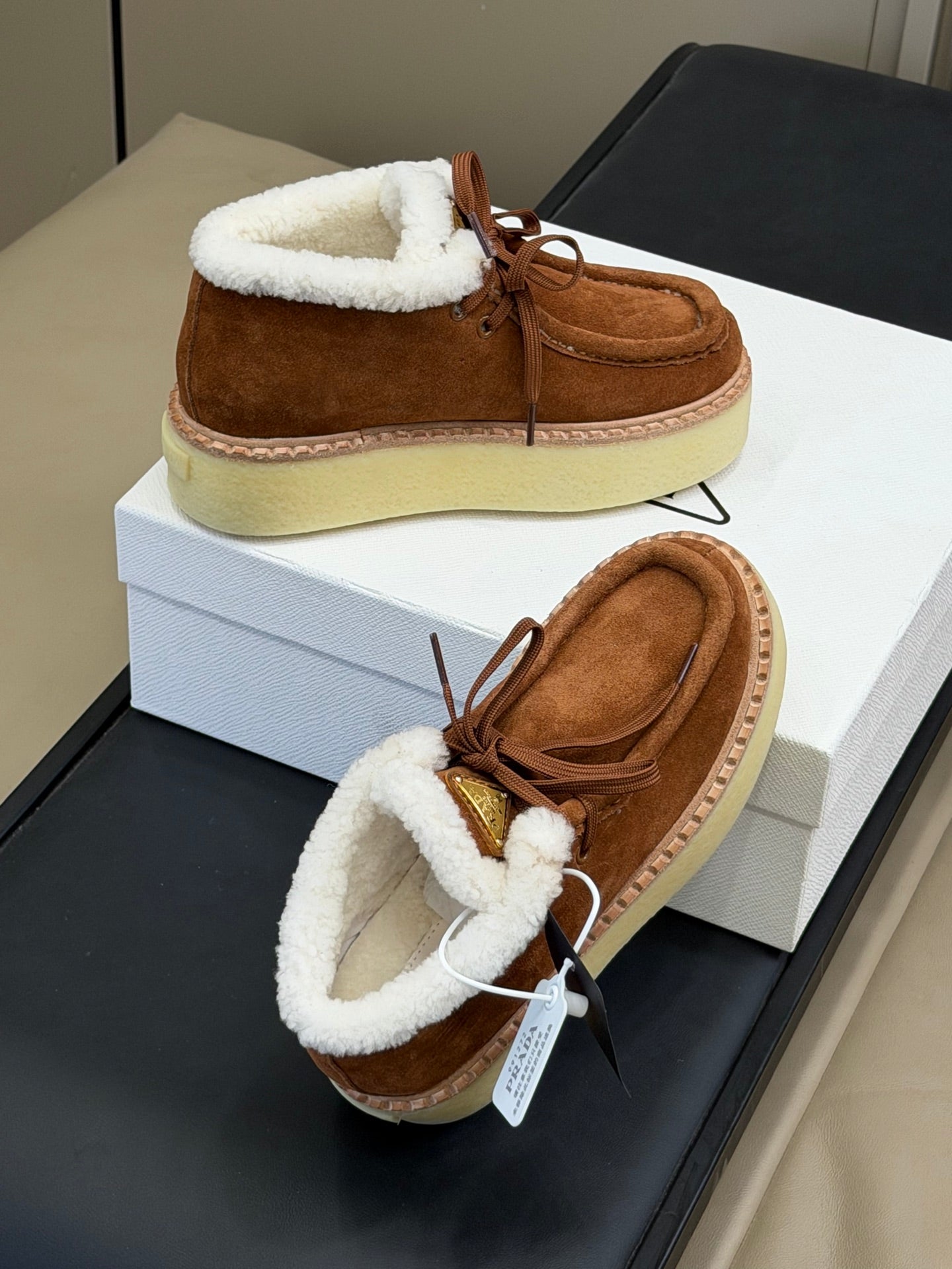 PRADA 25S HIGH-TOP SHOES 40 MM IN RK BROWN SUEDE SHEARLING-LINED