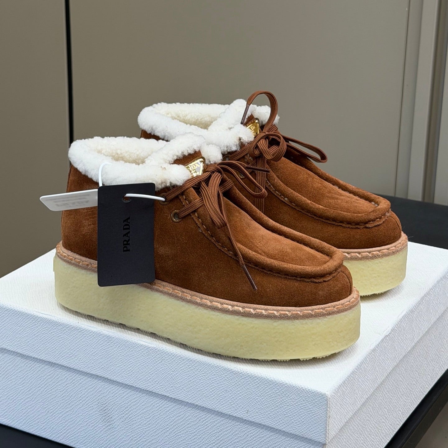 PRADA 25S HIGH-TOP SHOES 40 MM IN RK BROWN SUEDE SHEARLING-LINED