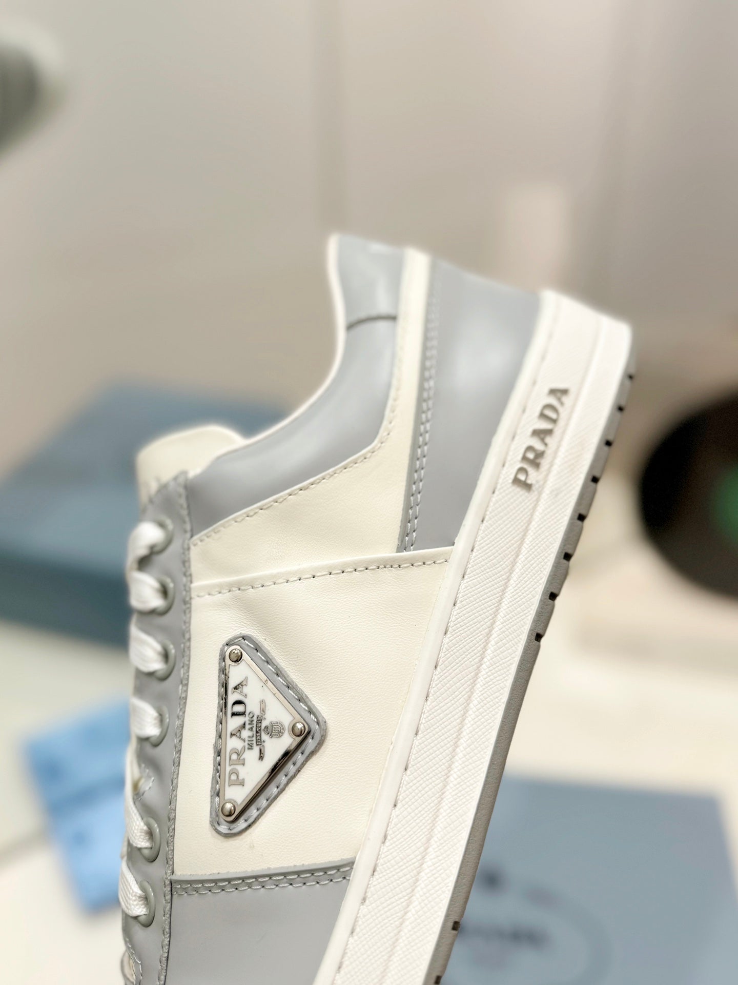 PRADA DOWNTOWN PERFORATED SNEAKERS WHITE AND GRAY CALFSKIN