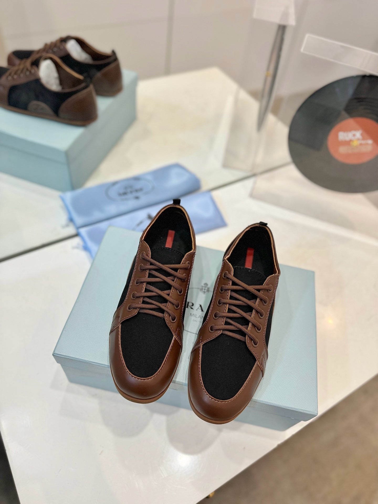 PRADA SNEAKERS IN BROWN LAMBSKIN AND BLACK CANVAS