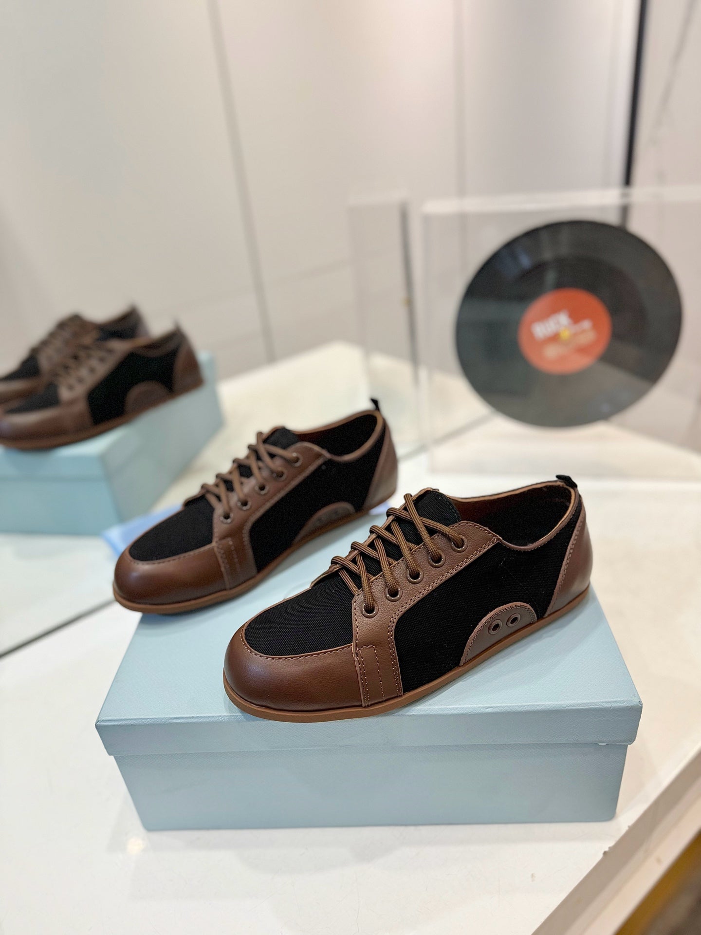 PRADA SNEAKERS IN BROWN LAMBSKIN AND BLACK CANVAS