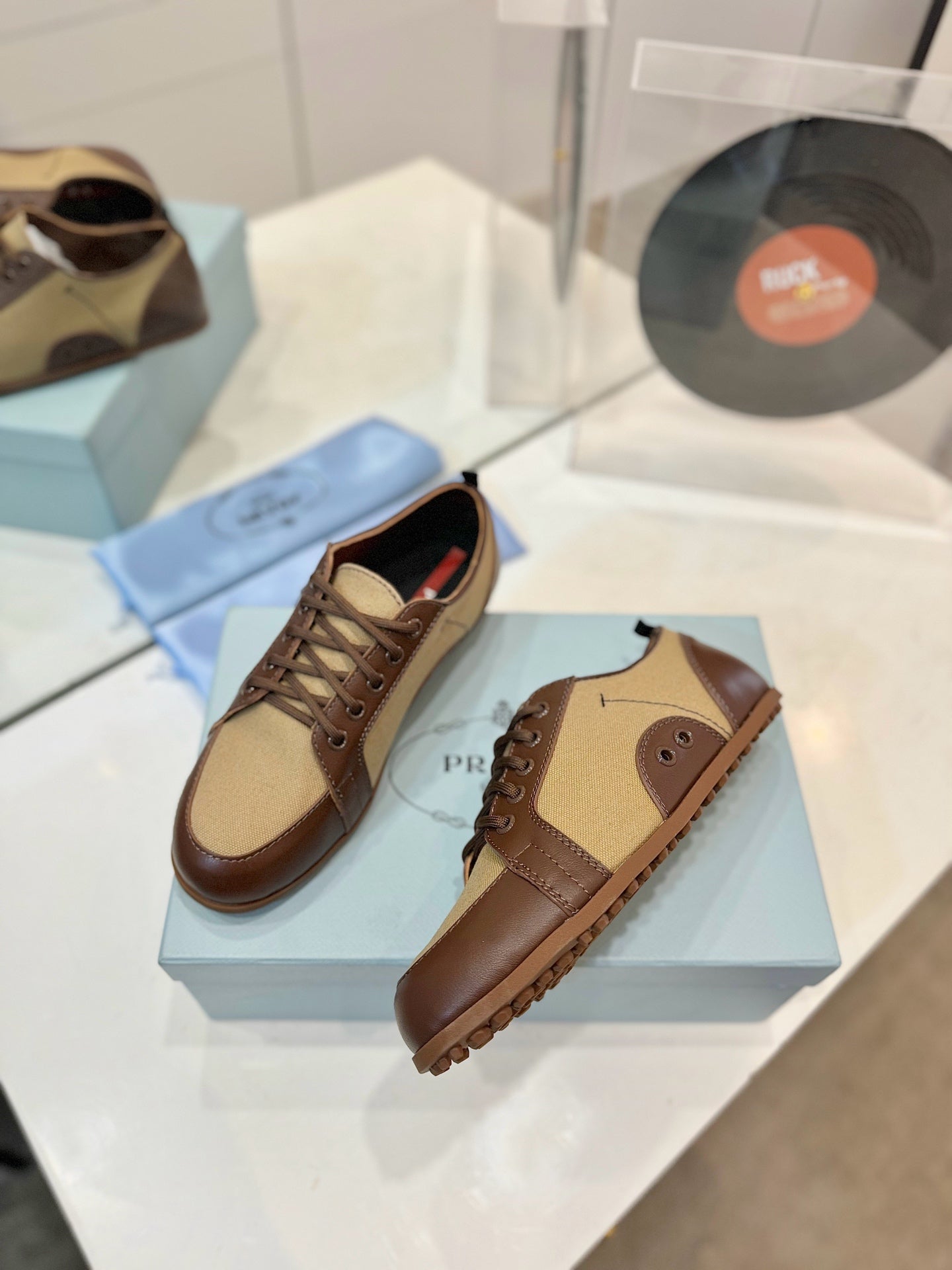 PRADA SNEAKERS IN BROWN LAMBSKIN AND BEIGE CANVAS